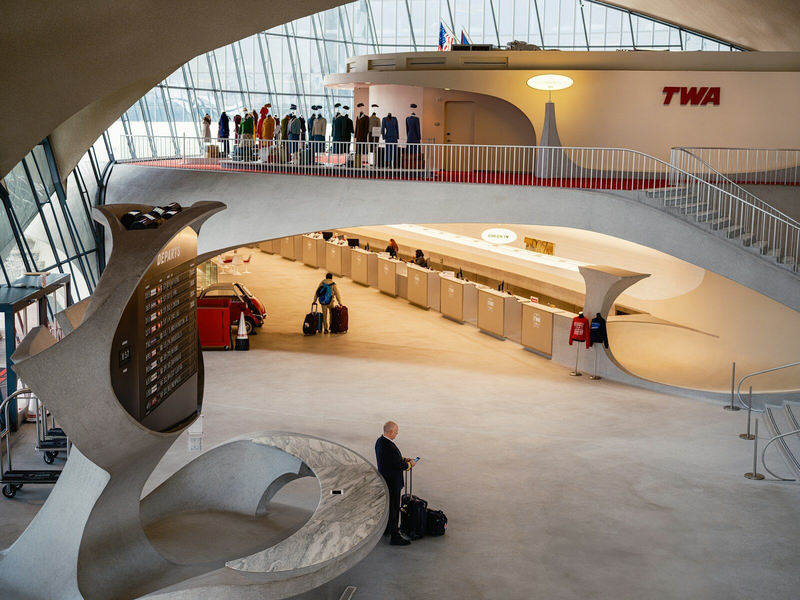 Inside a retro-styled airport terminal.